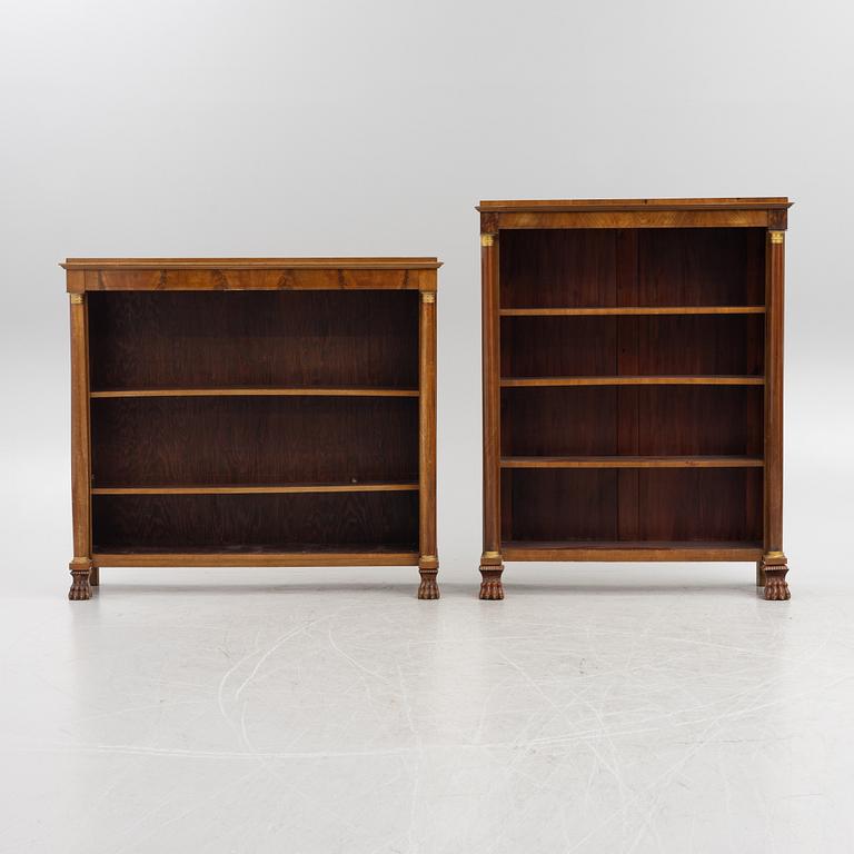 Two similar Empire style book cases, first half of the 20th century.