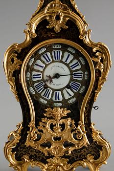 A 19th century mantle clock in the style of Louis XV.