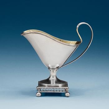 996. A Swedish early 19th century parcel-gilt cream-jug, makers mark of Arvid Floberg, Stockholm 1800.