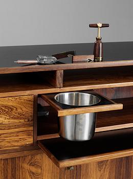 A Danish palisander bar by Dyrlund Smith, 1960´s, with four stools, marked AB COCKTAIL MÖBLER.