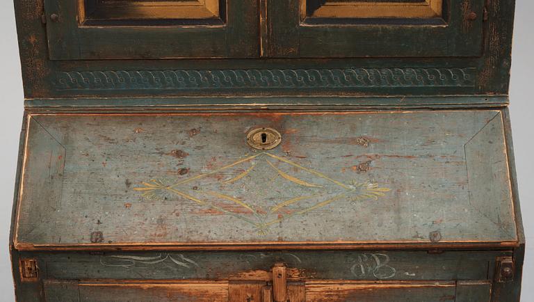 A polychrome-painted writing-cabinet attributed to J. Bäckström (1773-1837), dated 1828.