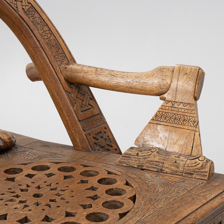 Armchair, after a design by Vasily Shutov called 'Arc, Axes and Mittens' Russia late 19th century.