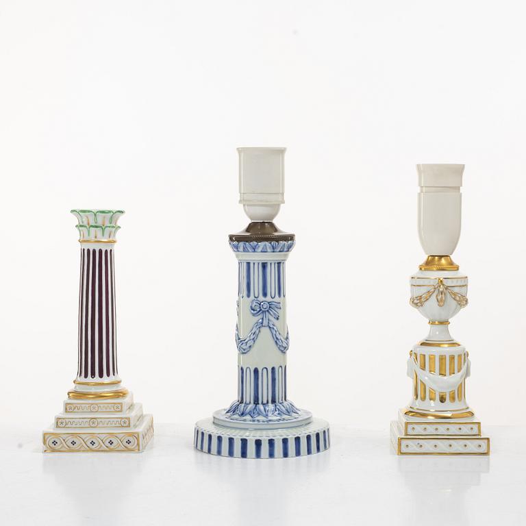 Royal Copenhagen, Two table lamps and a candlestick, Denmark, late 19th–early 20th century.