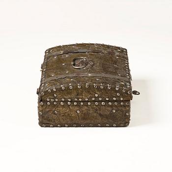 A presumably German baroque repoussé brass writing box, late 17th century.