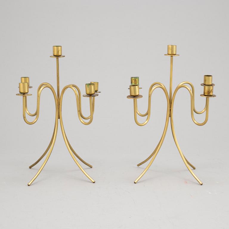 Gunnar Ander, a pair of five-light brass candelabra from Ystad Metall.