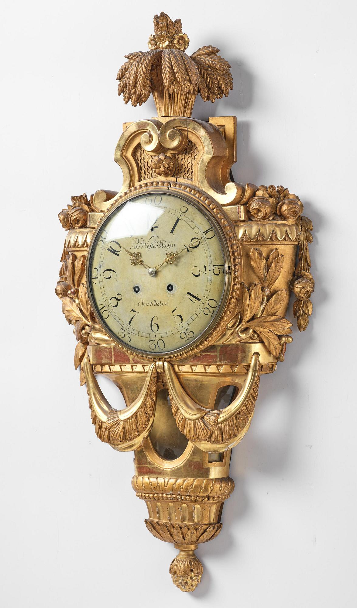 A Gustavian giltwood cartel clock by L. Adamson Wester (watchmaker in Stockholm 1780-95).