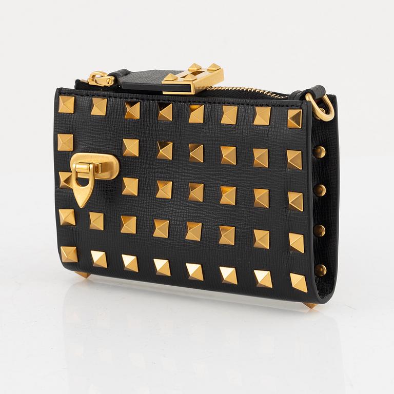 Valentino Garavani, a leather and studs wallet.