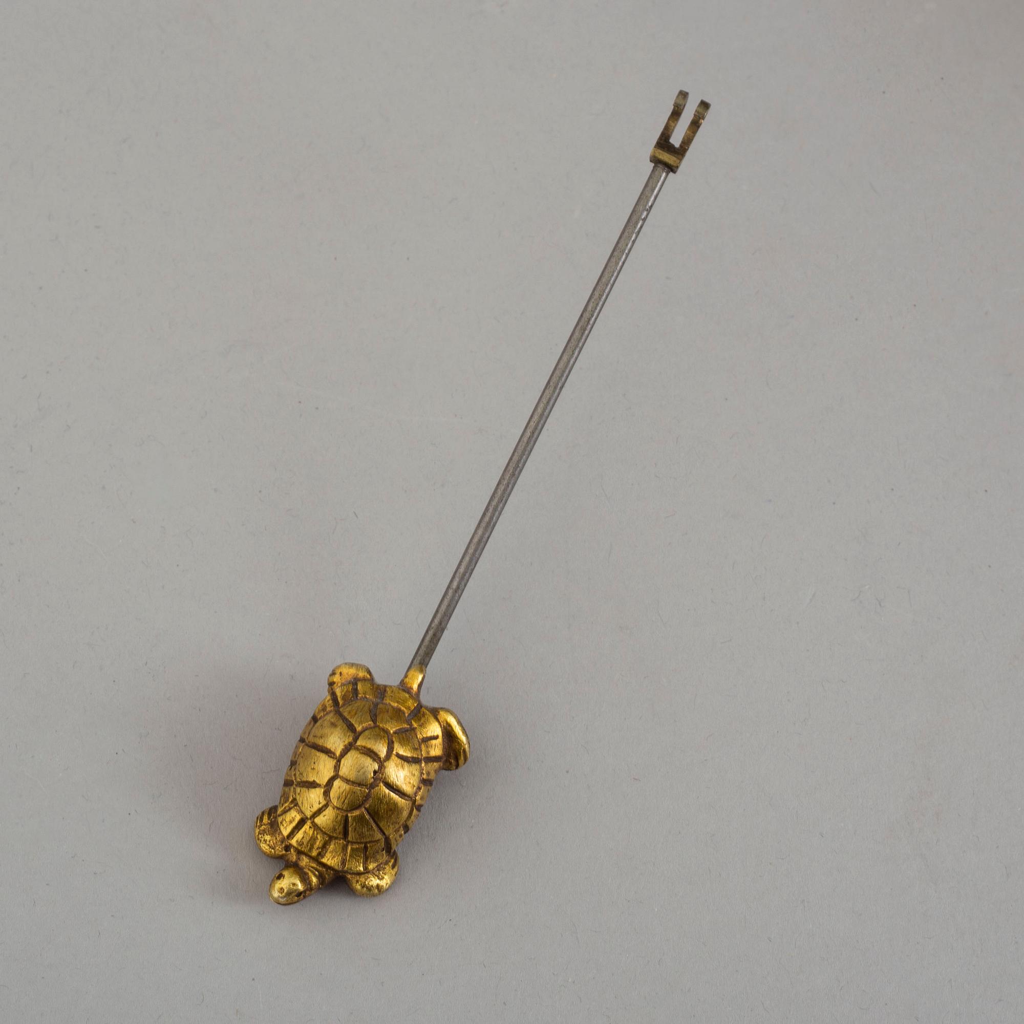 An early 20th century mantle clock with a bronze sculpture signed M. Charny.