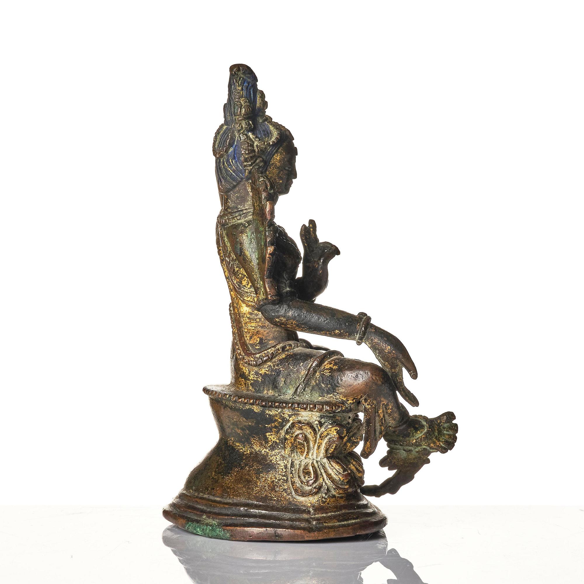 A copper alloy figure of Green Tara, Tibet, 17/18th century or later.