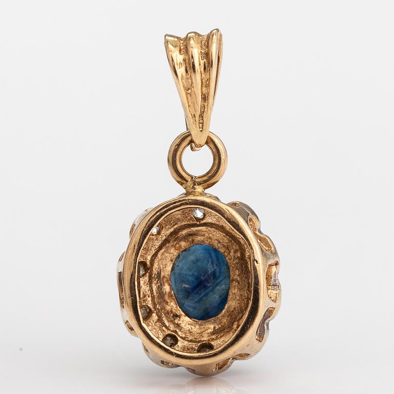 A 14K gold penadant with a sapphire and diamonds ca. 0.025 ct in total.