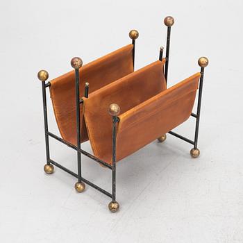 An iron and leather magazine stand. 20th Century.