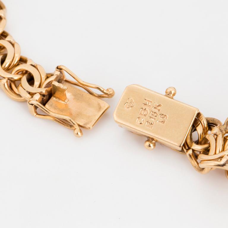 18K gold charm bracelet.