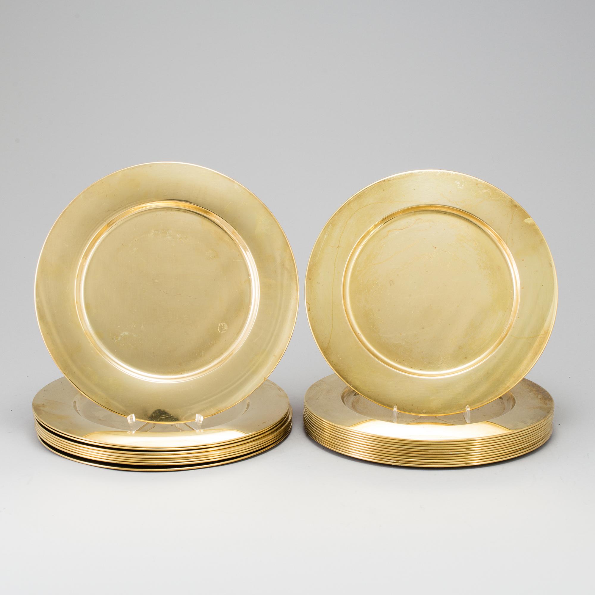 21 BRASS UNDER PLATES, second half of the 20th century.