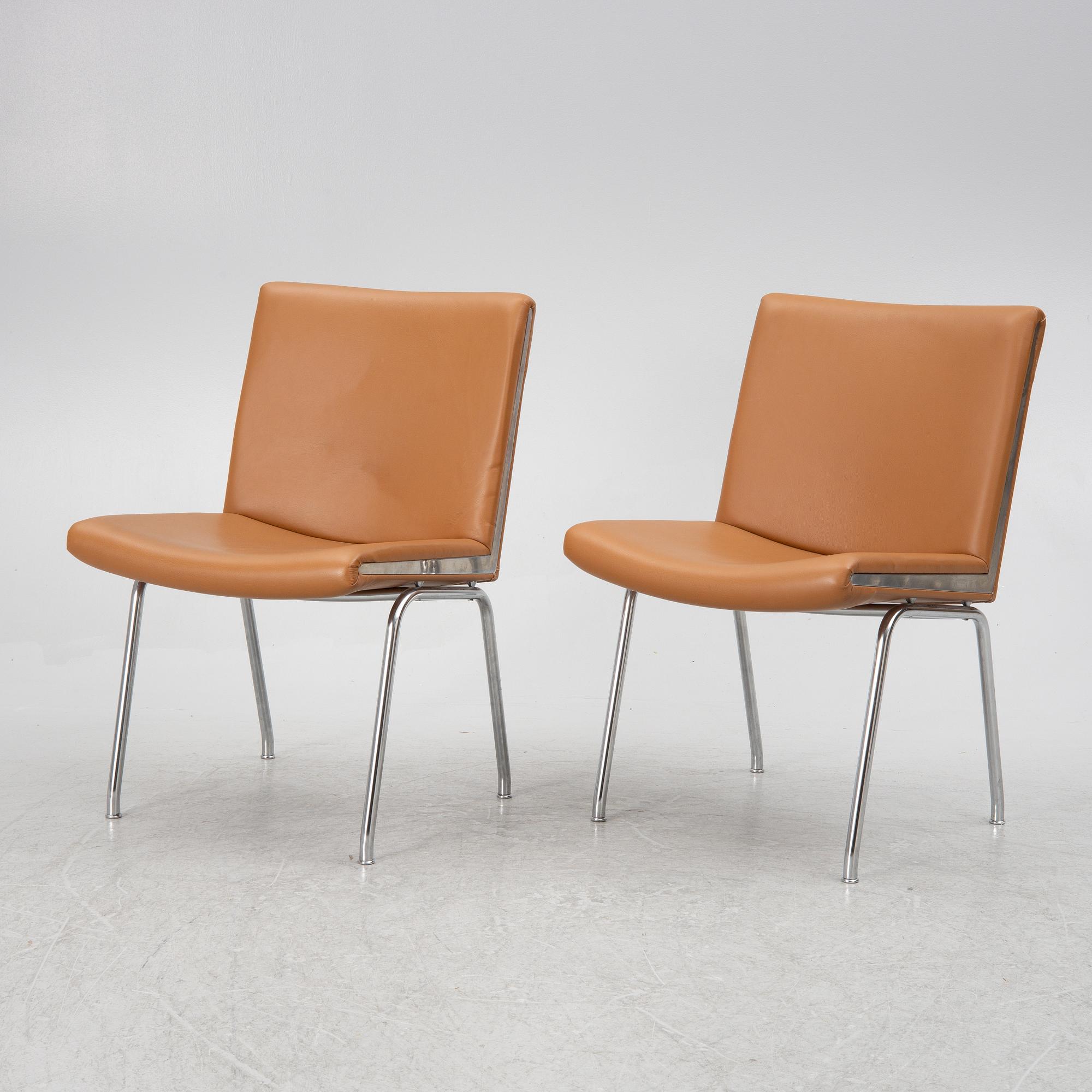 Hans J. Wegner, a pair pf "Kastrup Airport" lounge chairs, Denmark, late 20th century.