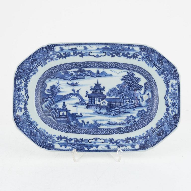 Two blue and white porcelain serving dishes and a stand for a butter tureen, China, Qianlong (1736-95).