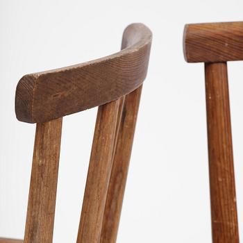 Axel Einar Hjorth, a set of four stained pine "Utö" chairs, Nordiska Kompaniet, Sweden, 1930s.