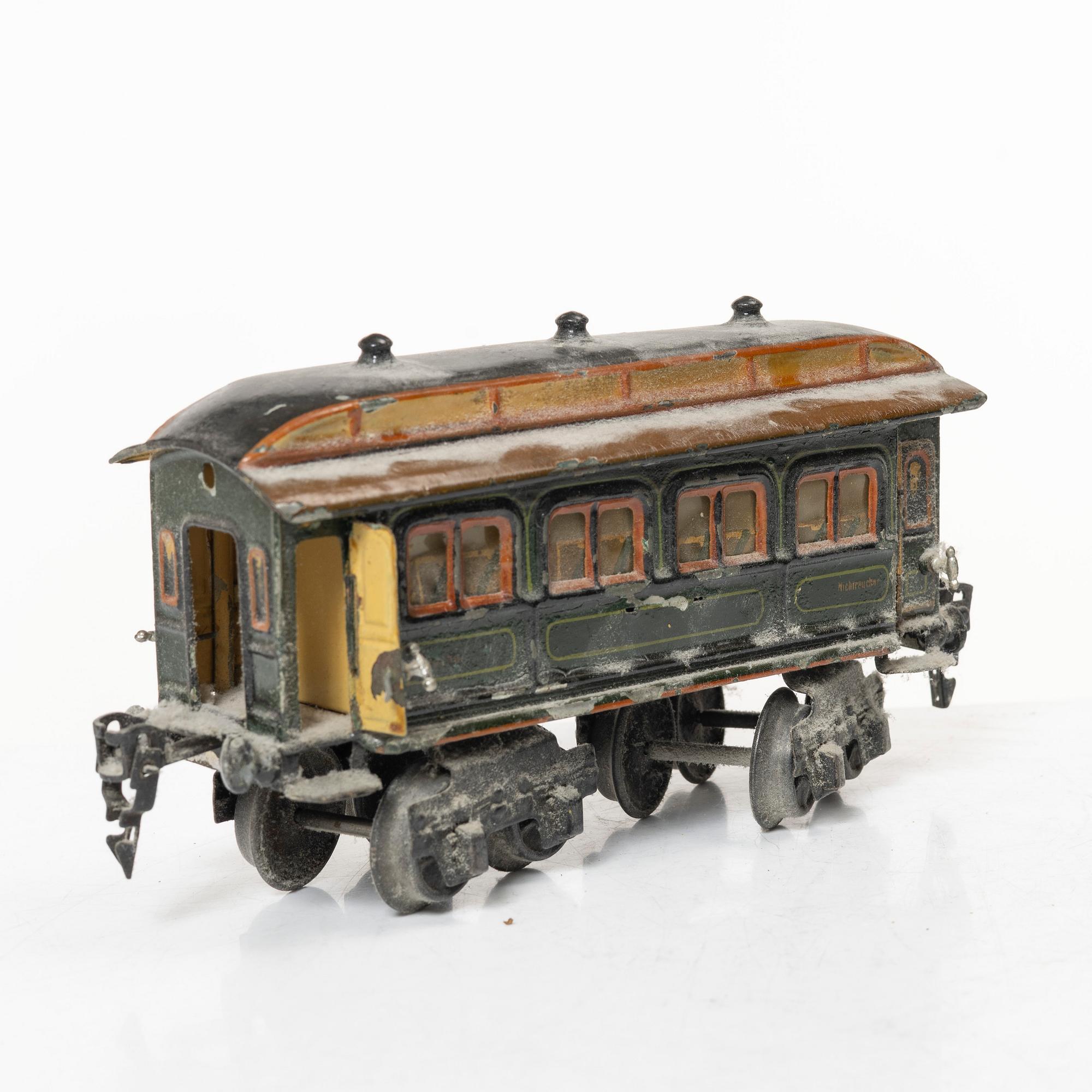 Model train with track and station building, 13 pieces, Germany, 1920s.