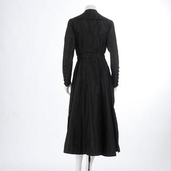 A black silkcoat from Nordisk Kompaniet 1916.