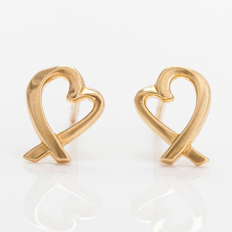 Tiffany & Co, Paloma Picasso, a pair of 18K yellow gold 'Loving Heart' earrings.