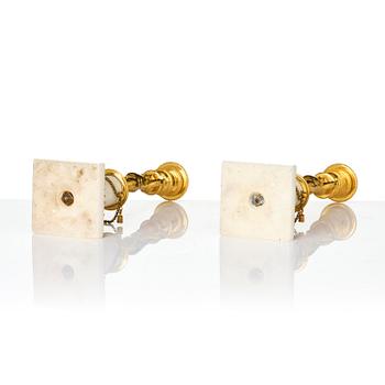 A pair of late Gustavian ormolu and white marble candlesticks, Stockholm, late 18th century.