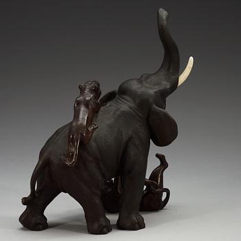 A Japanese bronze and ivory figure of an elephant attacked by two tigers, Meiji, ca 1900.
