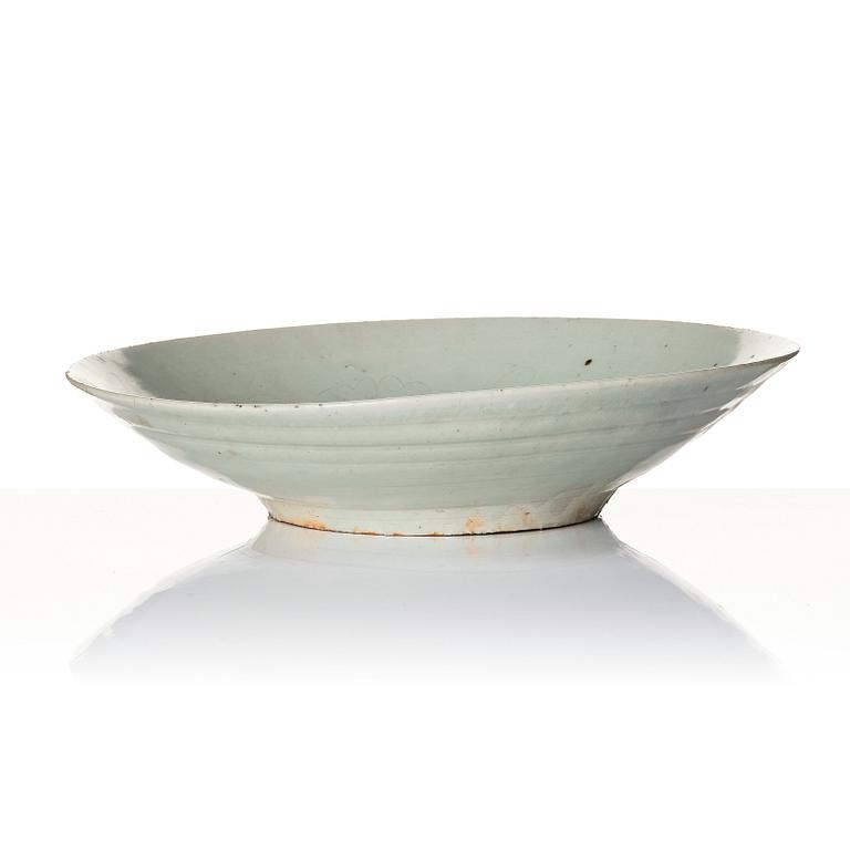 A large pale celadon glazed dish, Yuan/Ming dynasty.