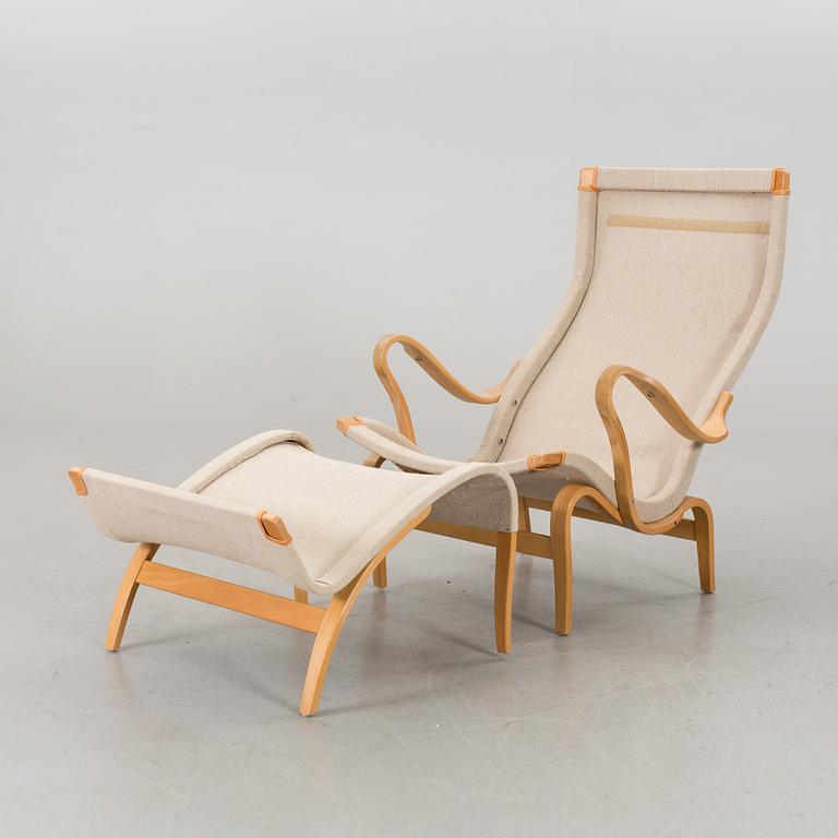 BRUNO MATHSSON, "PERNILLA" ARMCHAIR WITH STOOL.