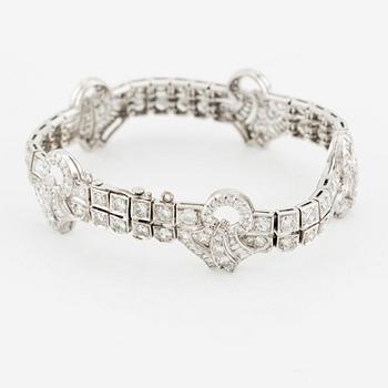 A platinum bracelet with round brilliant-, eight- and baguette-cut diamonds, Gübelin, founded in 1854.