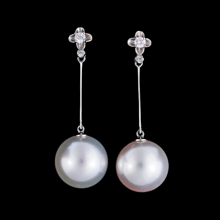 A pair of cultured South sea pearl, 13 mm, and brilliant cut diamonds, tot. app. 0.16 cts.