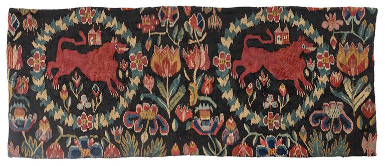 A cushion, 'Red Lion' (Rött Lejon), tapestry weave, ca 86 x 36 cm, southwestern Scania, first part of the 19th century.