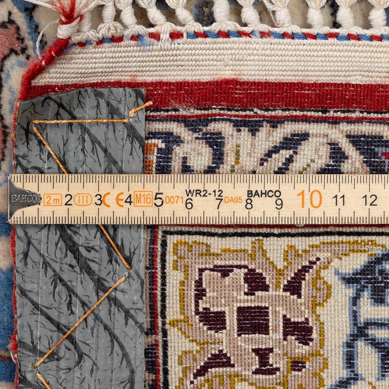 An Isfahan carpet, signed, approx. 372 x 255 cm.