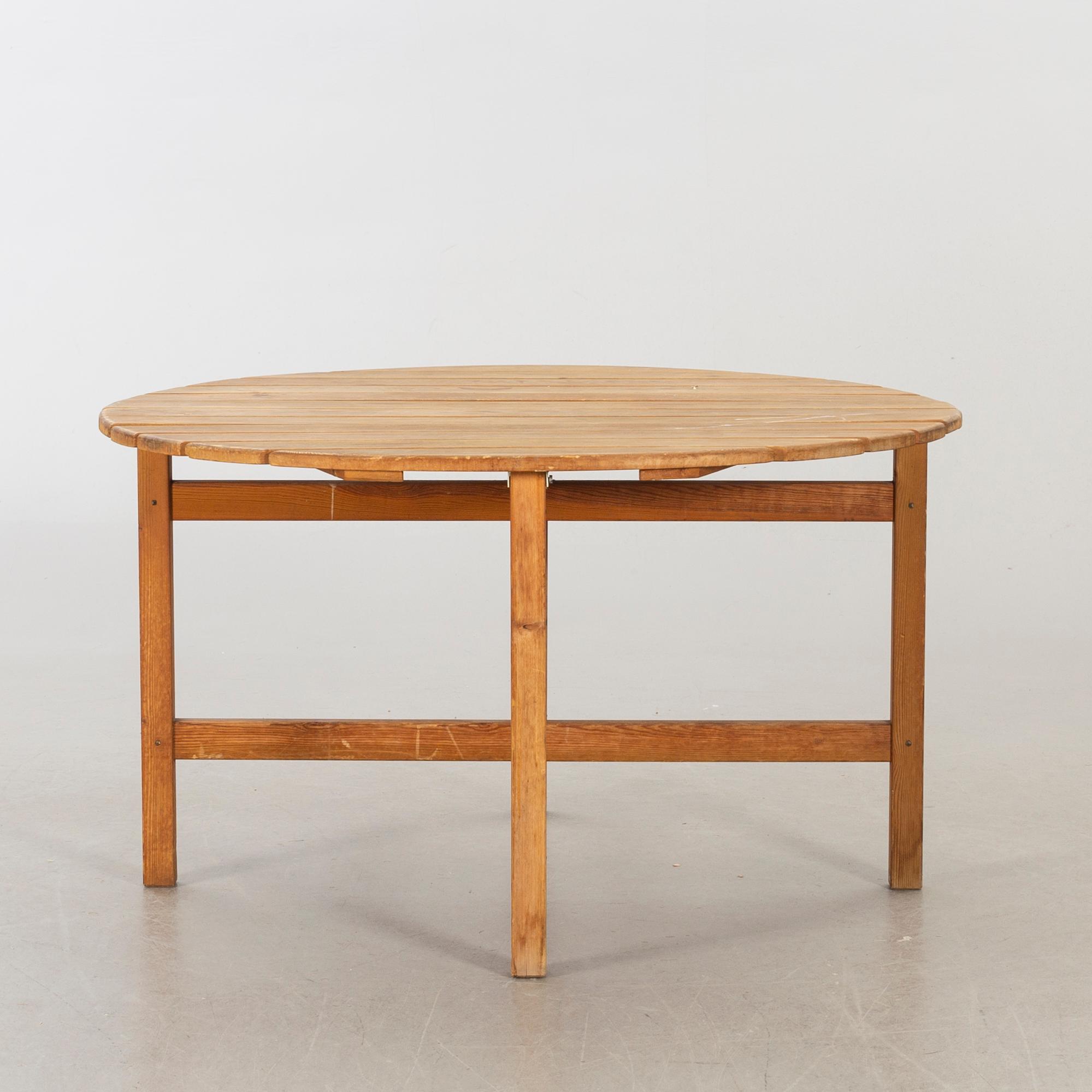 A circular garden table, probably Elsa Stackelberg for Fri Form.