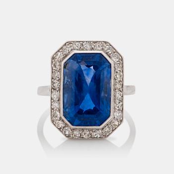 645. An Art Deco unheated emerald cut Ceylon sapphire, 8.20 ct, and single cut diamond ring. Certificate from SSEF.