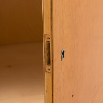 Alvar Aalto, mid-20th century '810' cabinet and a 
'69'chair Oy Huonekalu- ja Rakennustyötehdas Ab.