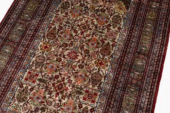 A semi-antique silk Qum rug, central Persia 221 x 138 cm.