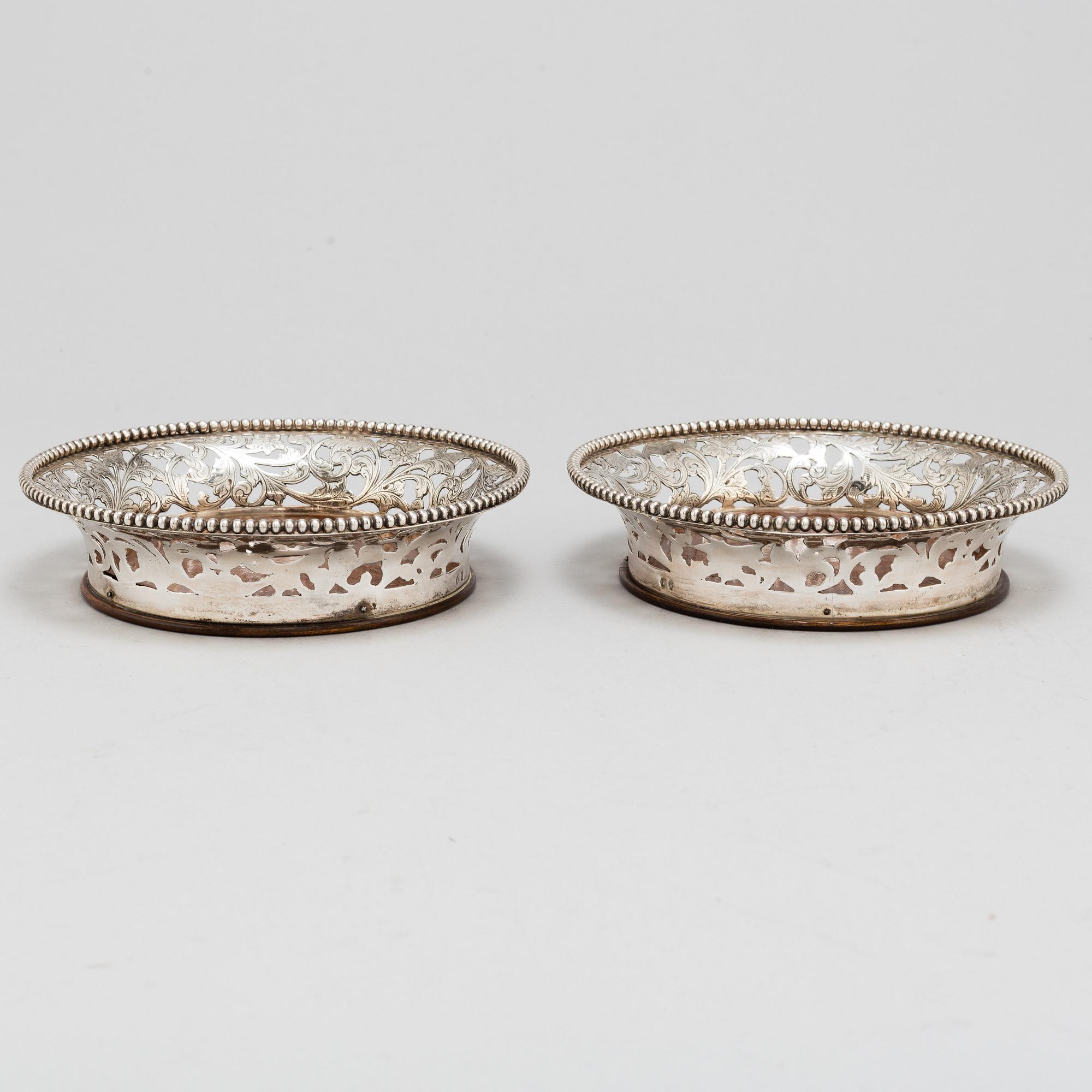 A pair of sterling silver coasters, late 20th Centrury.