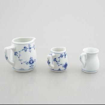 Three small jugs/creamers, a pair of small vases and two salt cellars, "Blue Fluted"/"Musselmalet", Royal Copenhagen.