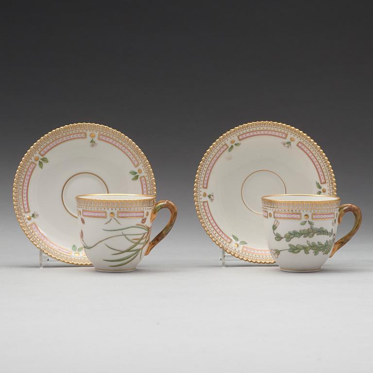 A set of eight cups with stands and six dessert dishes, Royal Copenhagen, 'Flora Danica', 20th Century.