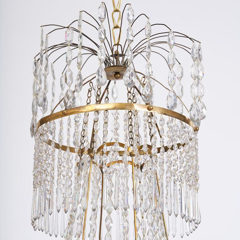 A late Gustavian thirteen-light gilt brass and cut glass chandelier, Stockholm, late 18th century.