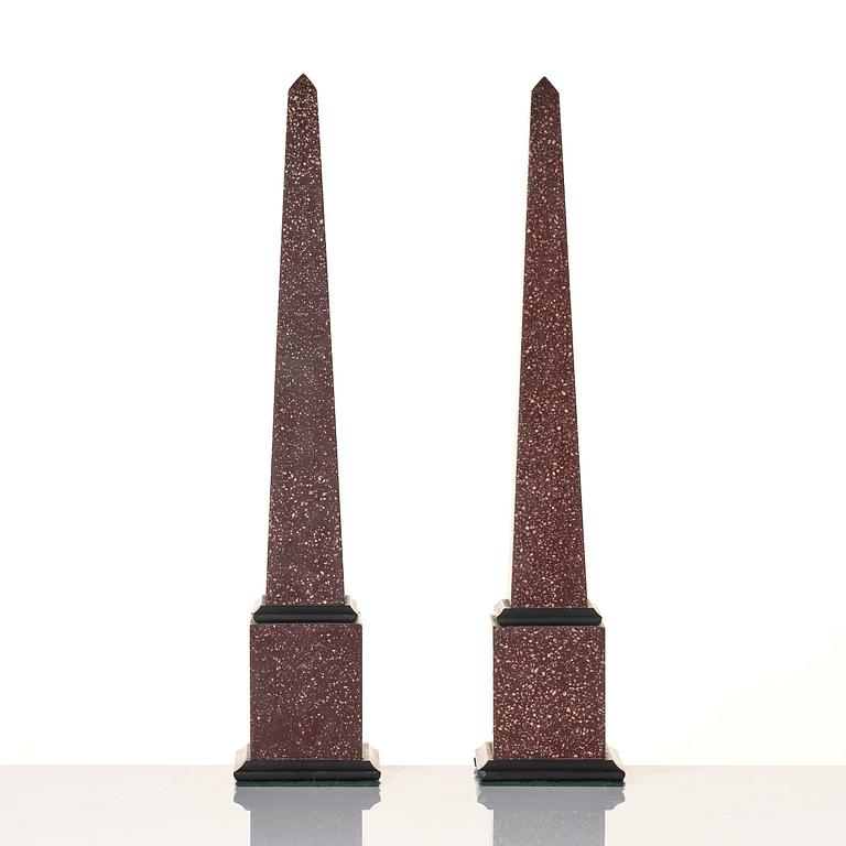 A pair of Egyptian porphyry obelisks 20 th century.