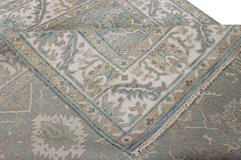 An oriental carpet with Mamluk design, c. 304 x 249 cm.