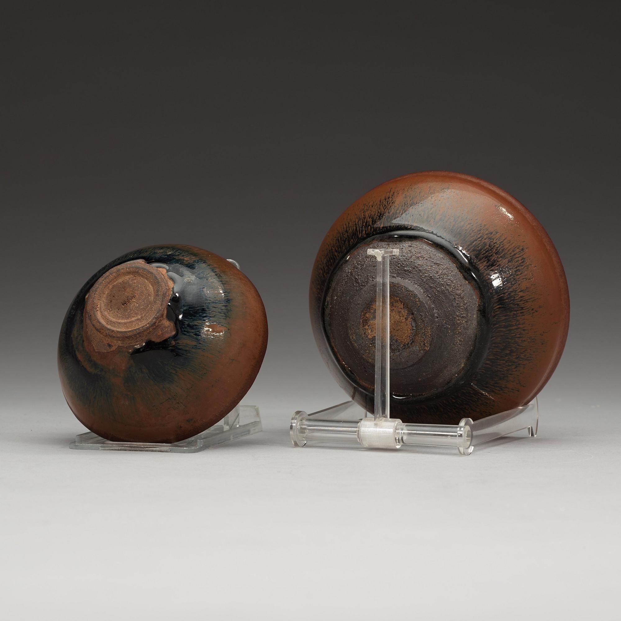 Two temmoku tea bowls, with 'hare's fur' glaze, the glaze pooling short of the unglazed feet. Song dynasty (960-1279).