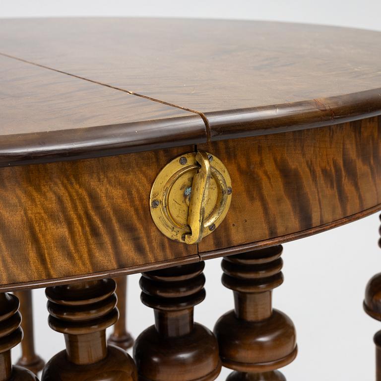 Dining table, circa 1900.