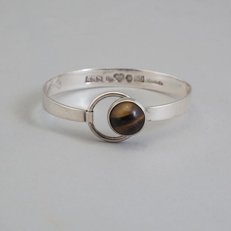 ARVO SAARELA, a silver and tiger eye bracelet from Enköping, 1968.