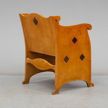 An early 20th century birch armchair.