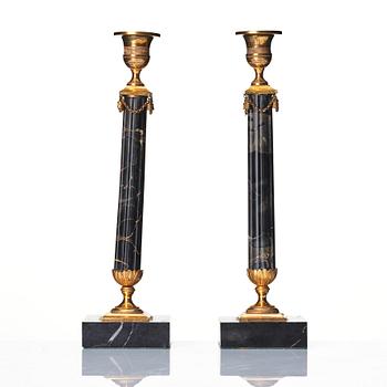 A pair of late Gustavian Portor marble candlesticks, late 18th century.