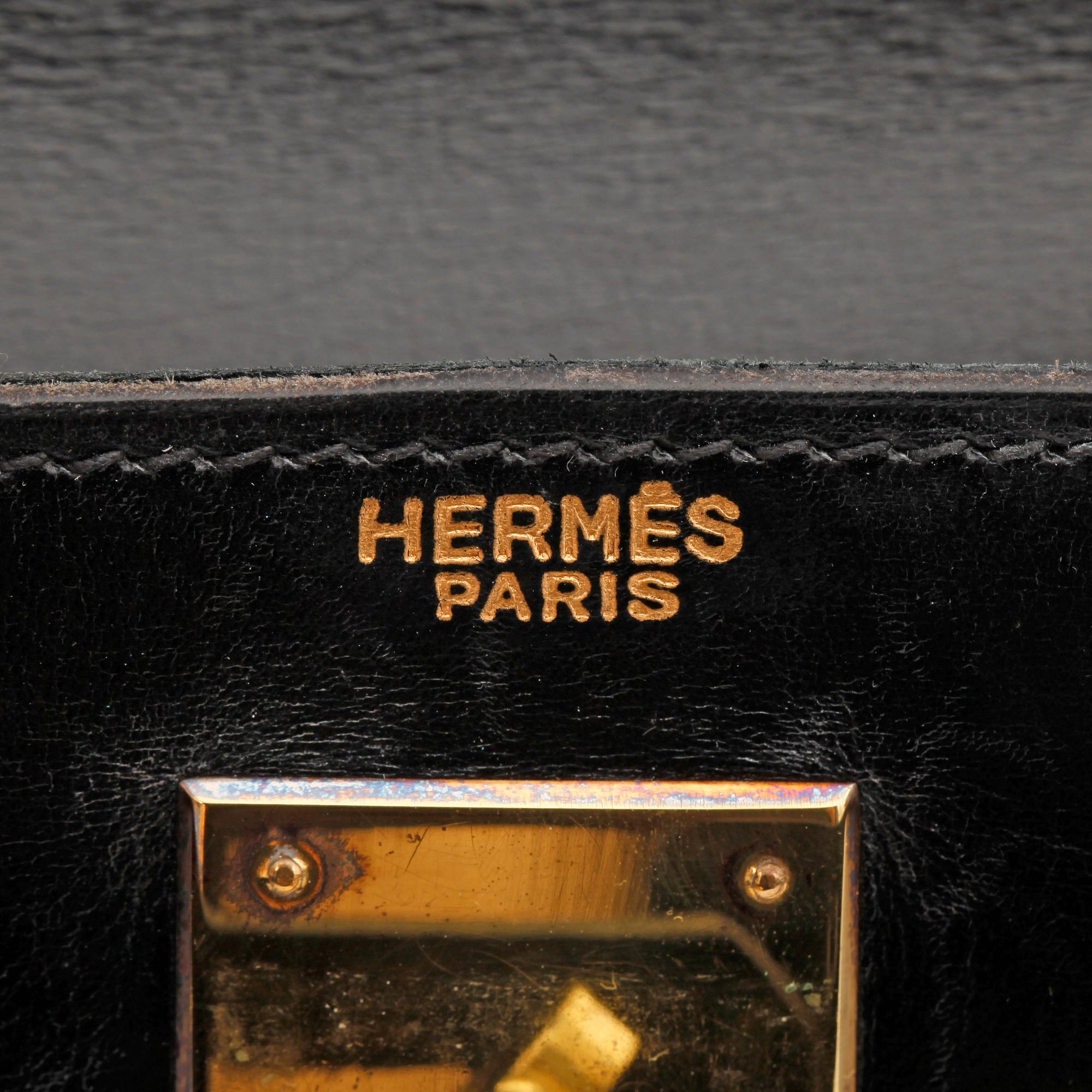 HERMÈS, a black leather bag, "Kelly 28".