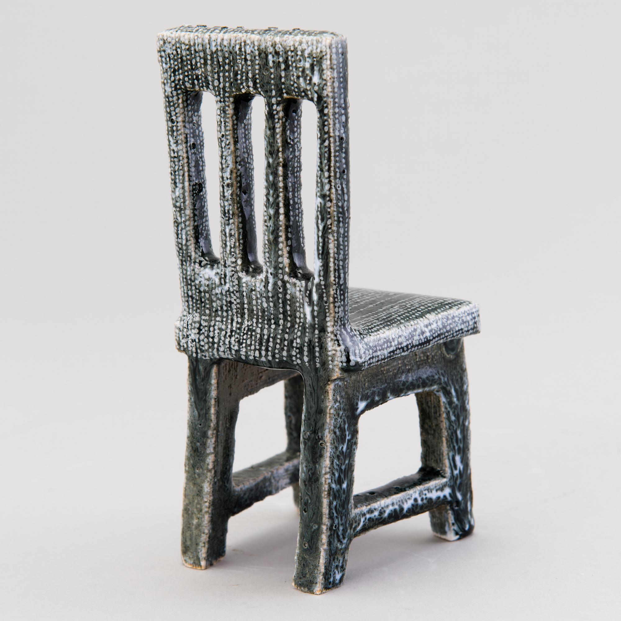 HEINI RIITAHUHTA, a porcelain miniature sculpture 'Chair' signed Heini Riitahuhta.