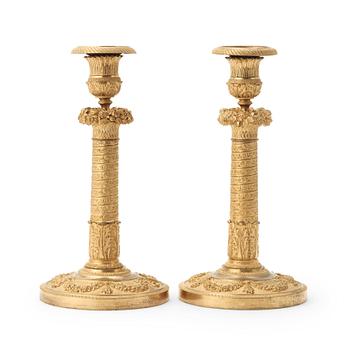 59. A pair of Empire candlesticks.