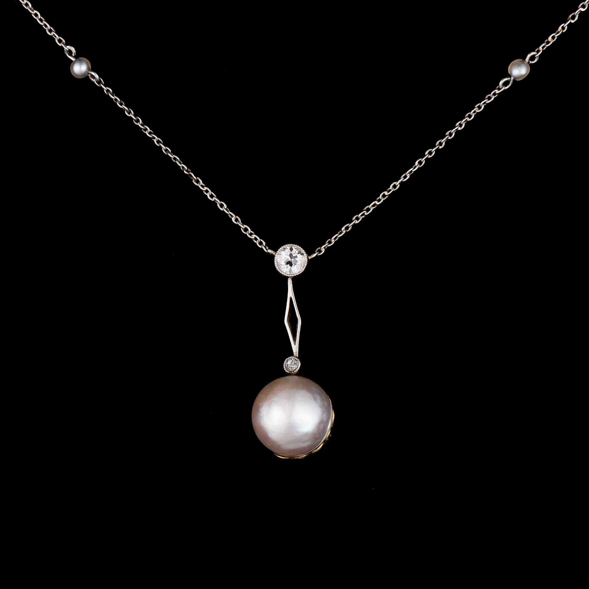 A PENDANT, platinum, diamond, pearl. Russian maker's marks, St Petersburg early 1900s.
